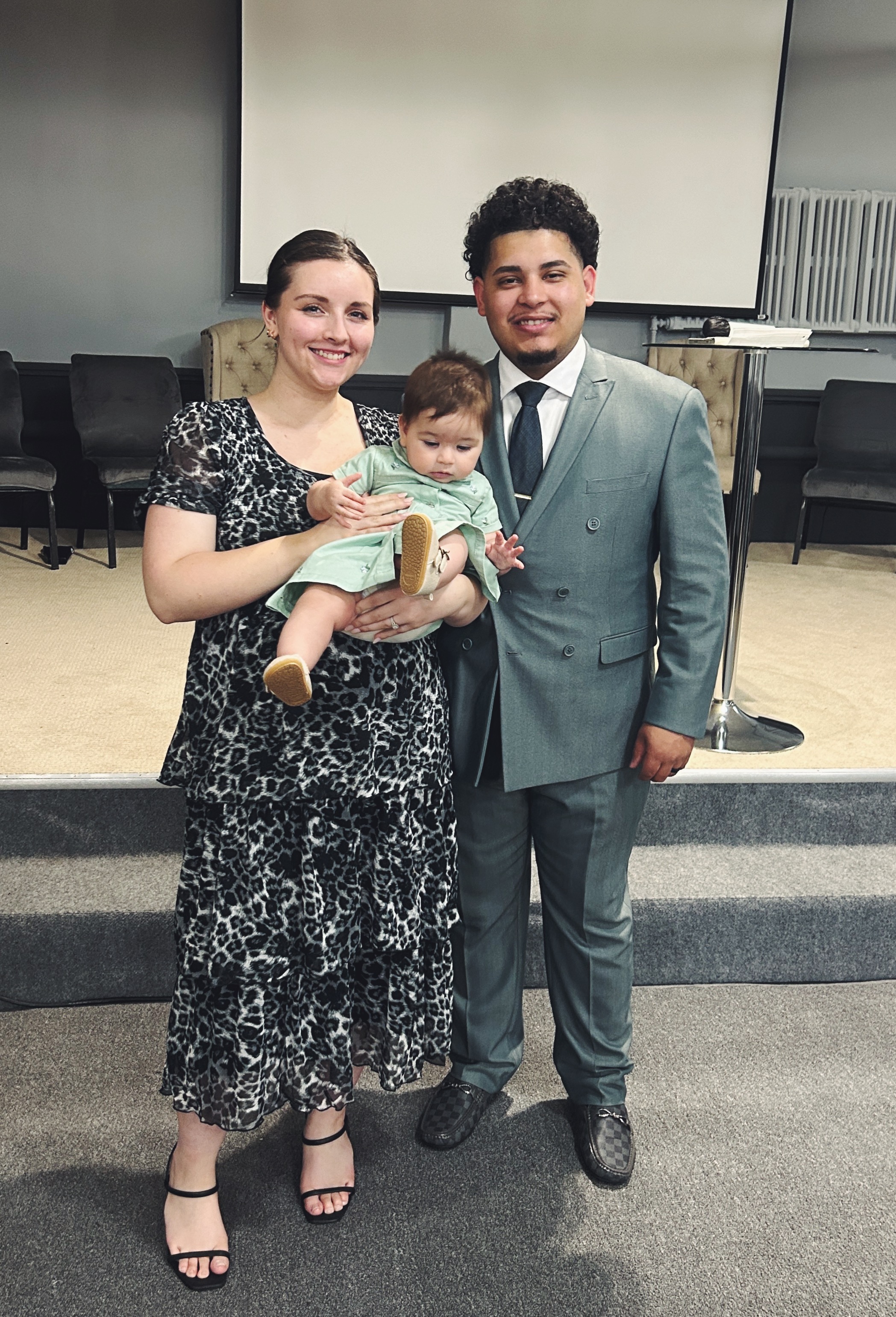 Evangelist Izaiah Diaz with his wife Kaylie and their child