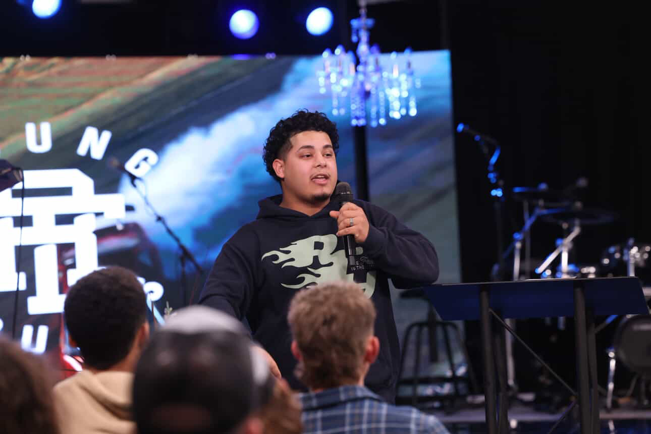 Izaiah preaching at the Young Adults service