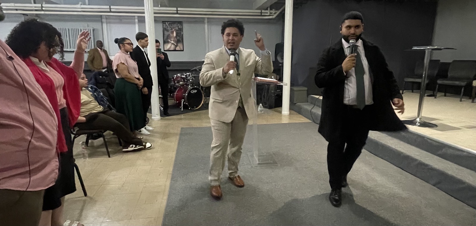 Izaiah Diaz preaching with another minister at the Buffalo Two Day Outpouring