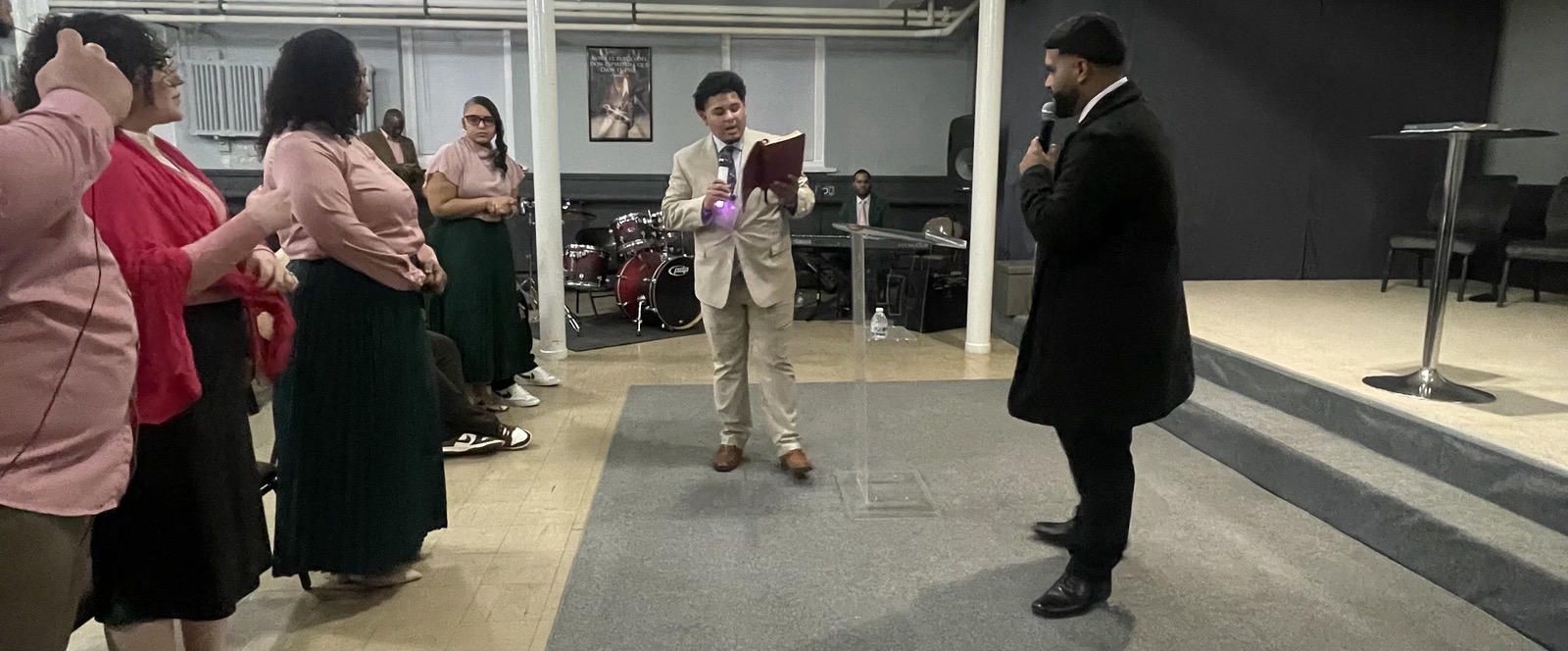 Izaiah Diaz reading the Word from his Bible at the altar